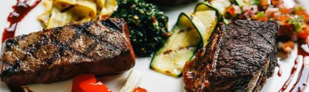 A fancy farm-to-table steak dinner with local herbs an ingredients.